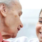 Senior woman and young caregiver talking.